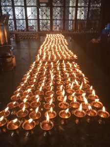 a group of lit candles on a table