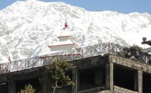 Guna Mata Temple with snow-covered Dhauladhar mountains in the backdrop