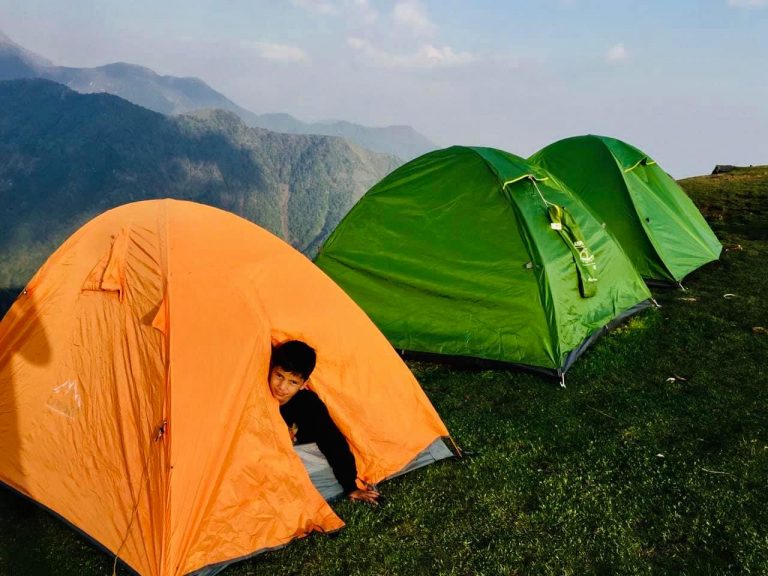 a boy in a tent