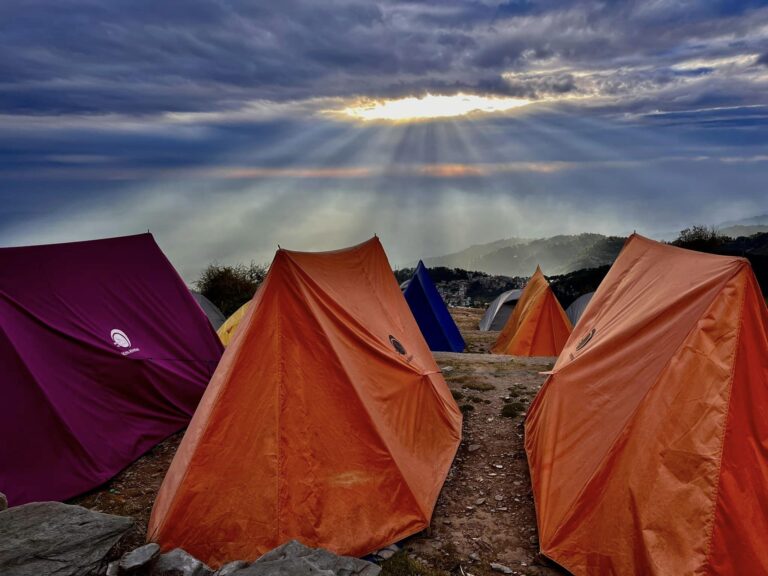 a group of tents on a hill