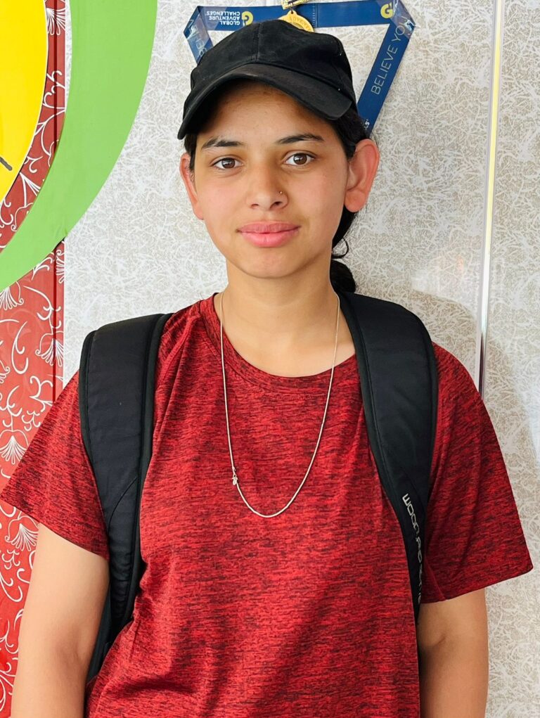 a woman wearing a backpack and a black hat