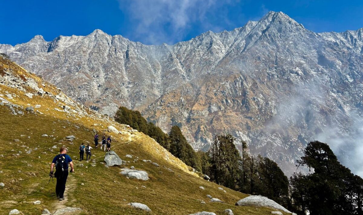 Scenic view of Dharamshala with Dhauladhar mountains under changing weather conditions
