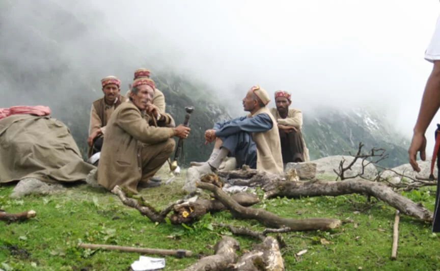 Trekkers crossing Indrahar Pass on the Shepherd Trail Trek in Himachal Pradesh